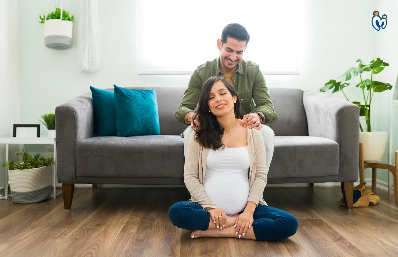 Latin husband giving his pregnant wife support